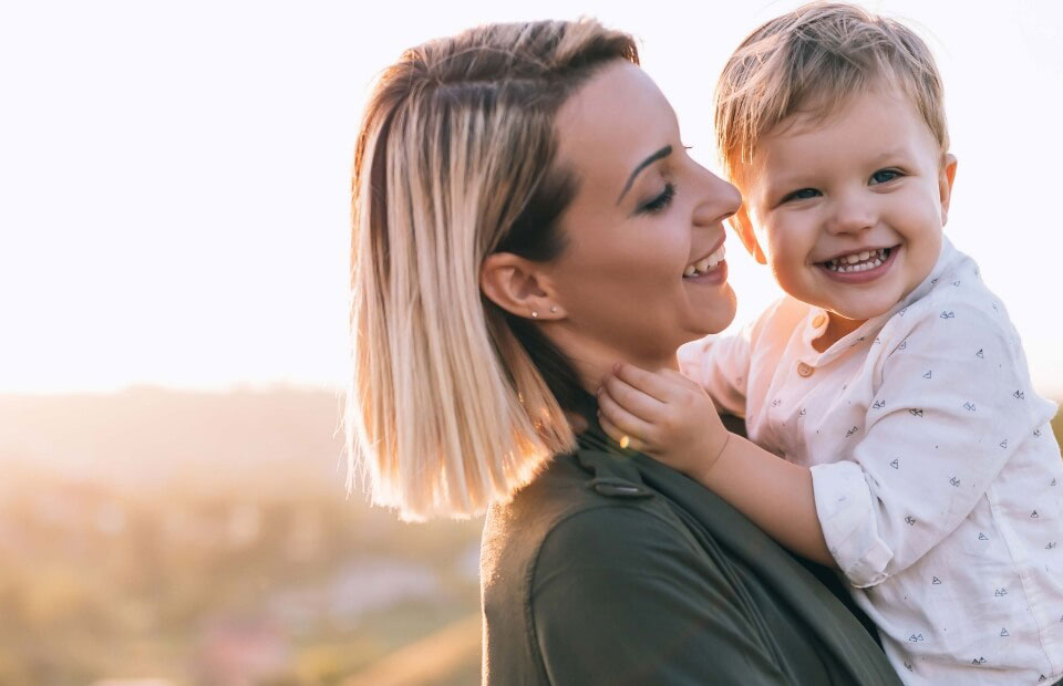 mom smiling with her son after visiting the dentist in Wenatchee, WA