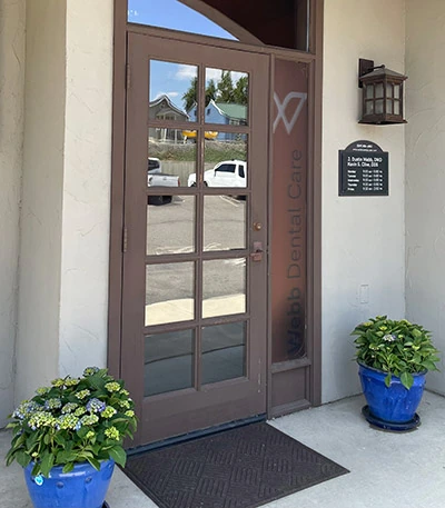 The front door to the office building of Webb Dental Care in Wenatchee, WA